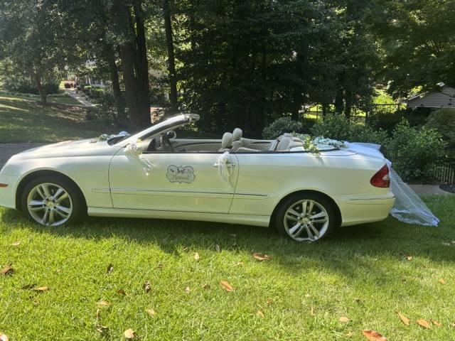 Victoria's white Mercedes CLK350 dressed for a wedding